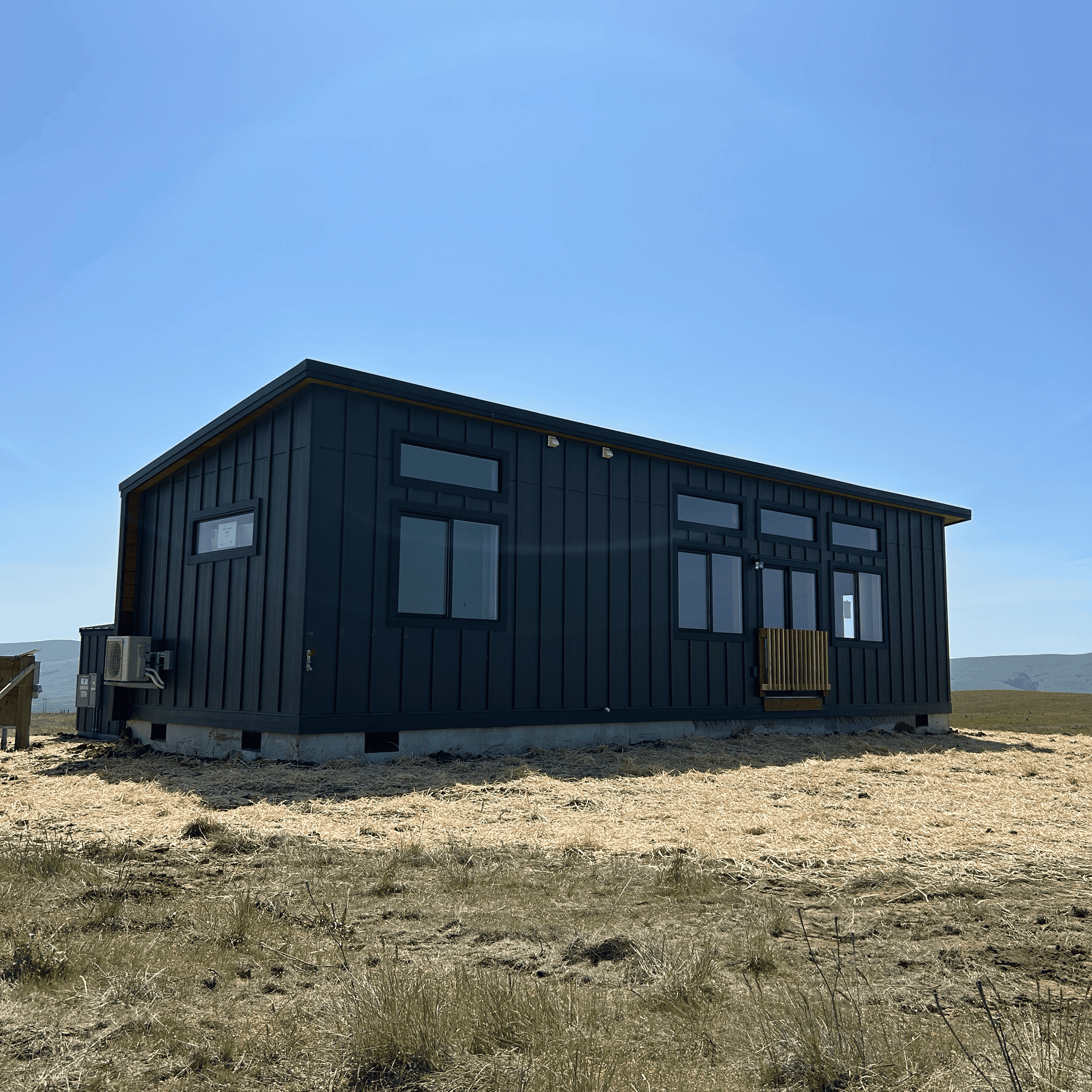 Black Wolf Model E home with board and batten siding.