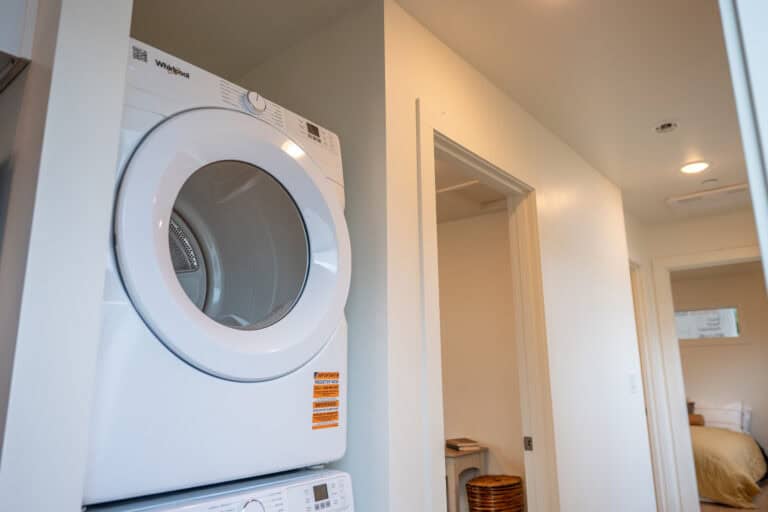 Stacked dryer in a Wolf Model F home at Orchards District Cottages