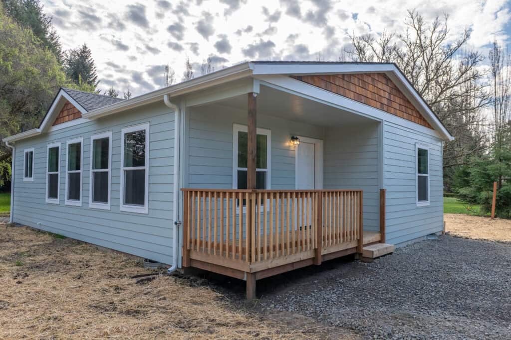 Covered front porch deck in a Wolf Model L home.