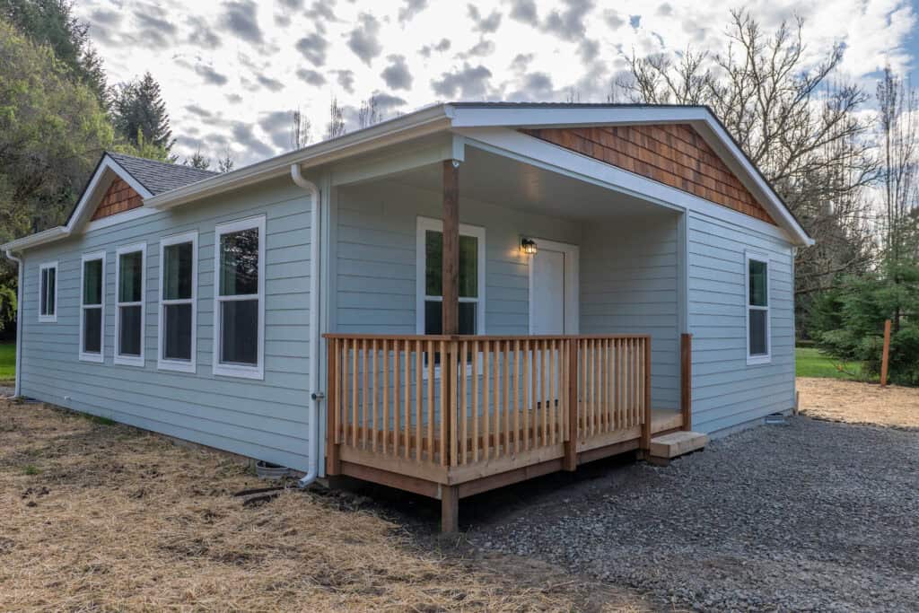 Covered front porch deck in a Wolf Model L home.