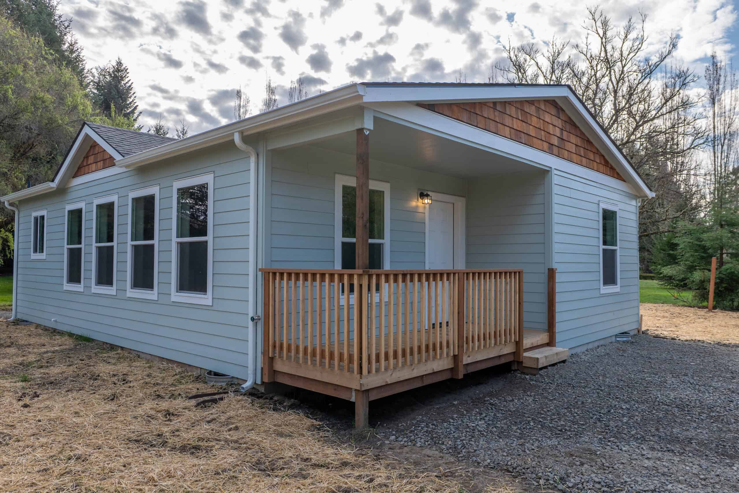 Covered front porch deck in a Wolf Model L home.