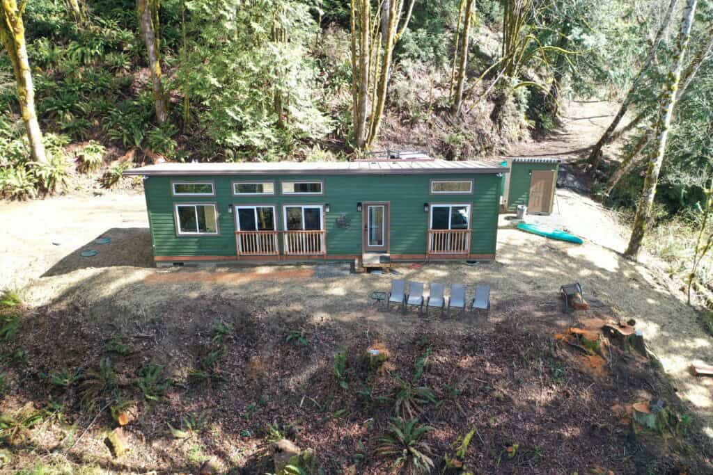 Green and brown Wolf Model E home in Seabeck WA.