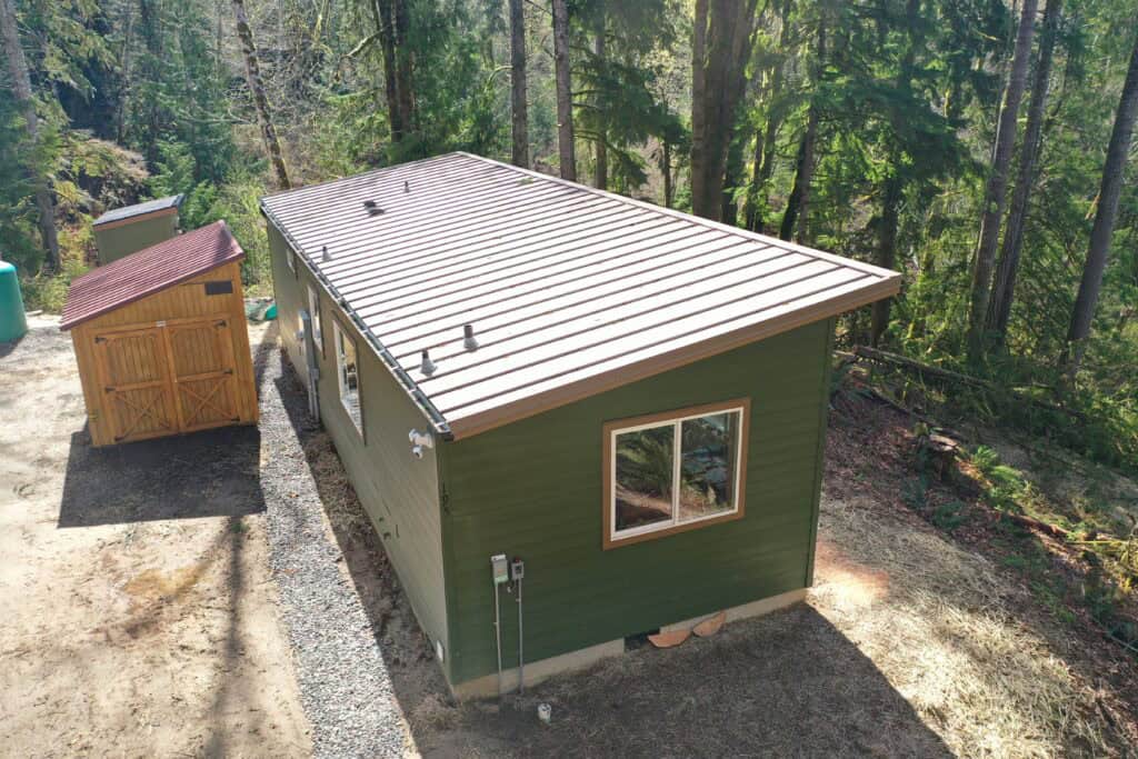 Green and brown Wolf Model E home in Seabeck WA.