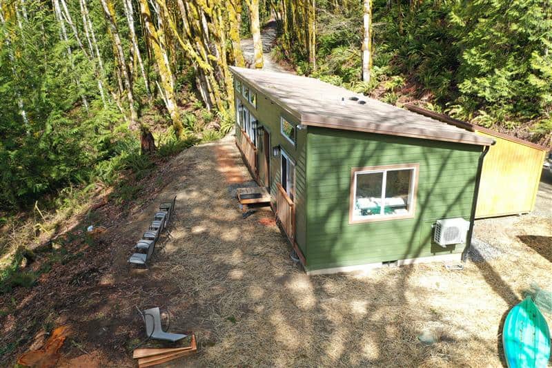 Green and brown Wolf Model E home in Seabeck WA.