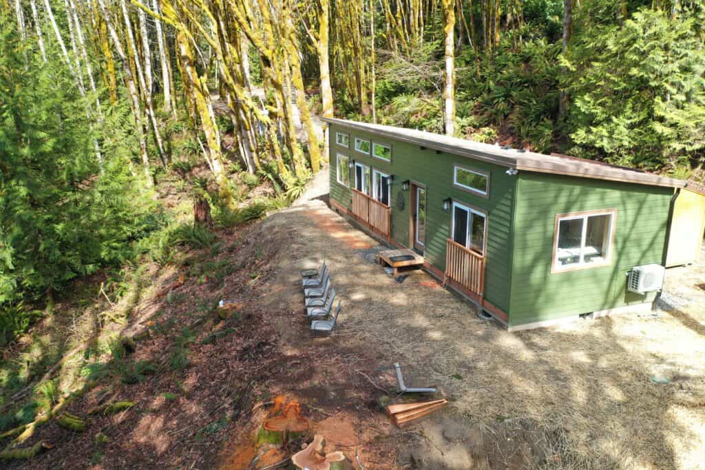 Green and brown Wolf Model E home in Seabeck WA.