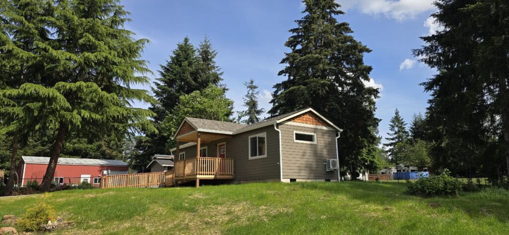 Wolf Model E home with l-shaped ramp entry and covered porch deck.