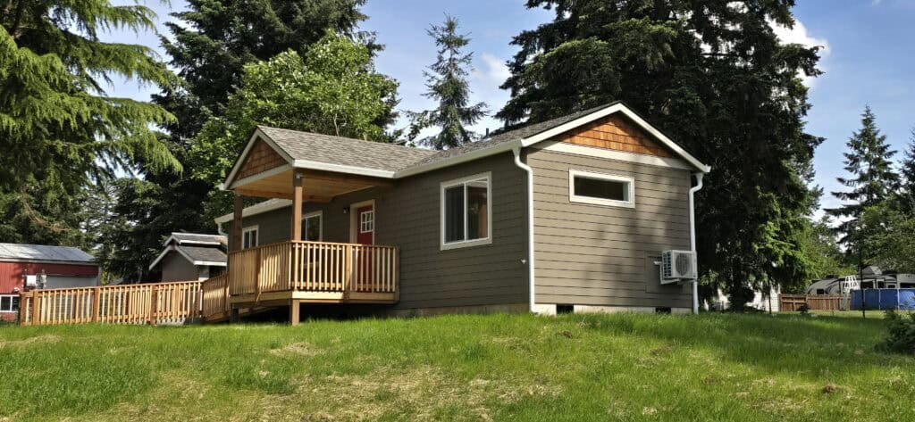 Wolf Model E home with l-shaped ramp entry and covered porch deck.