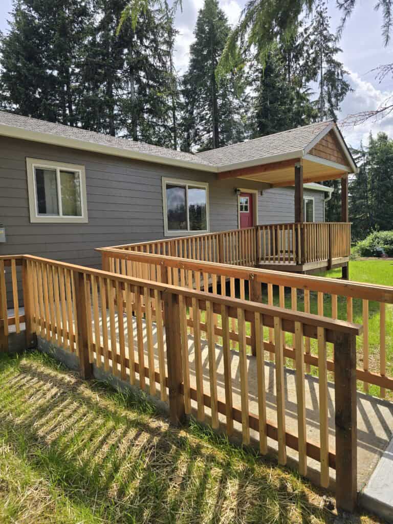 Ramped entry with a covered porch deck on a Wolf Model E home.