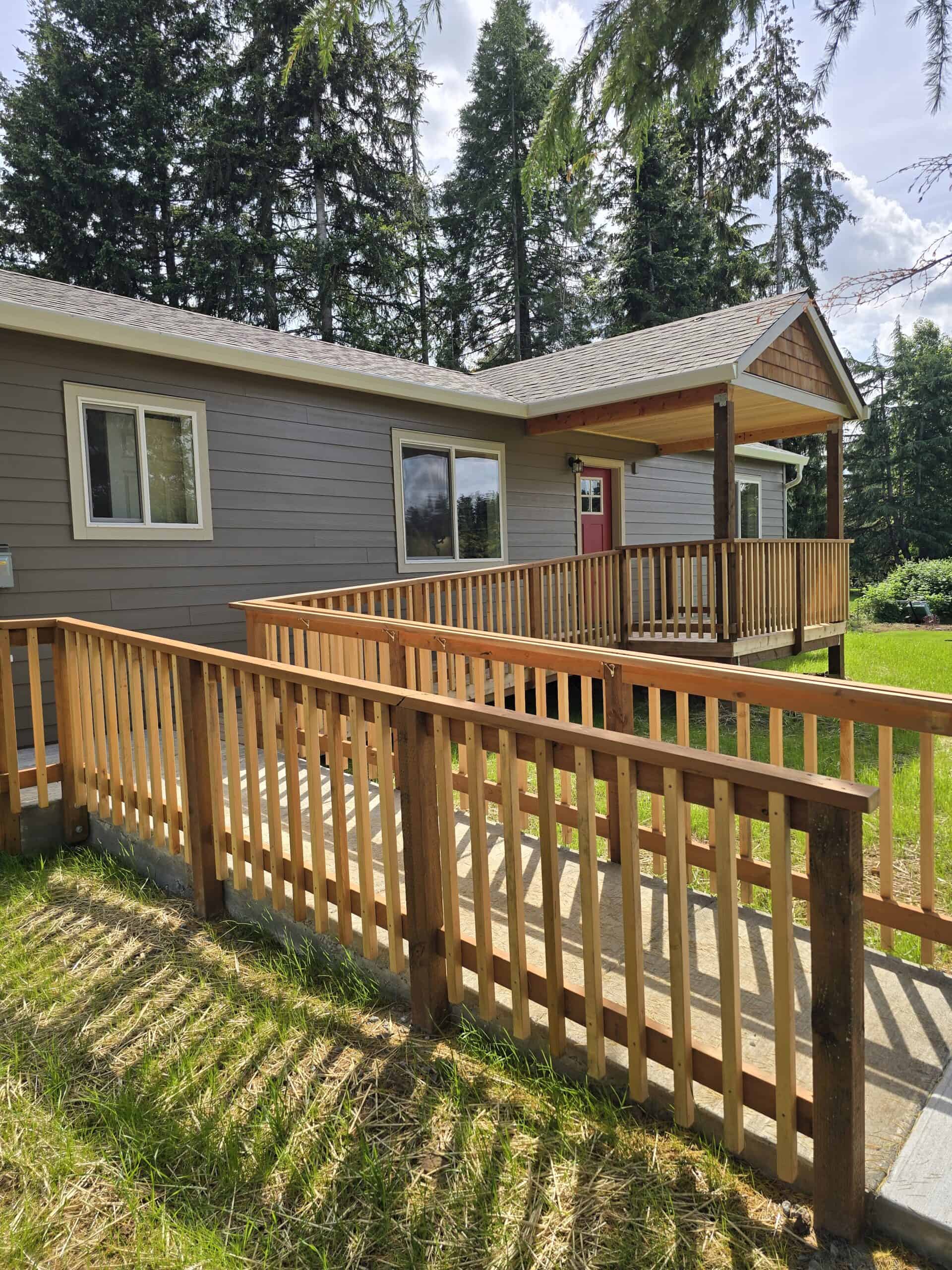Ramped entry with a covered porch deck on a Wolf Model E home.
