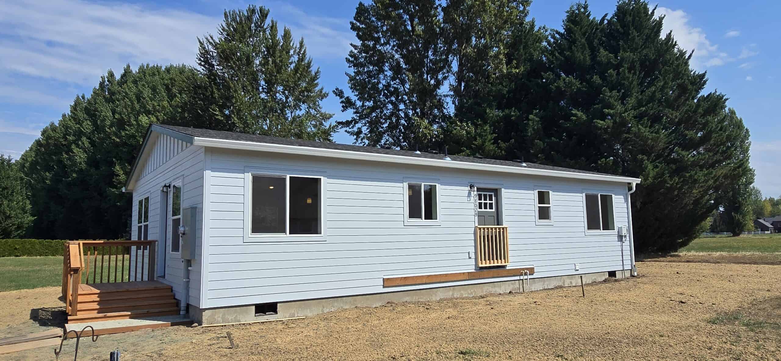 Light blue Wolf Model I modular home.