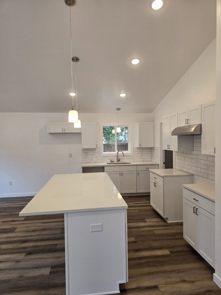 L-shaped island kitchen in a Wolf Model I modular home.