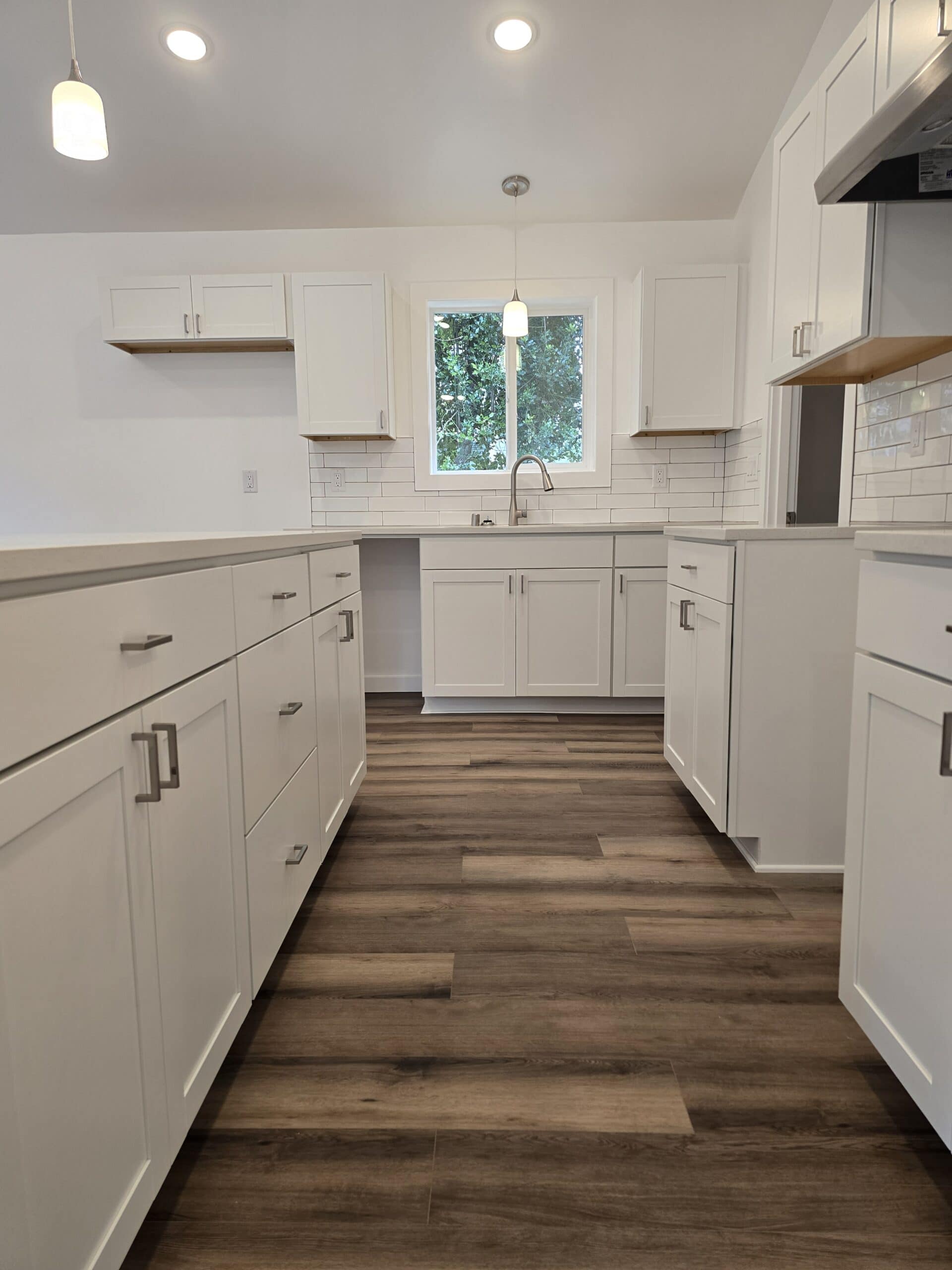 L-shaped island kitchen in a Wolf Model I modular home.