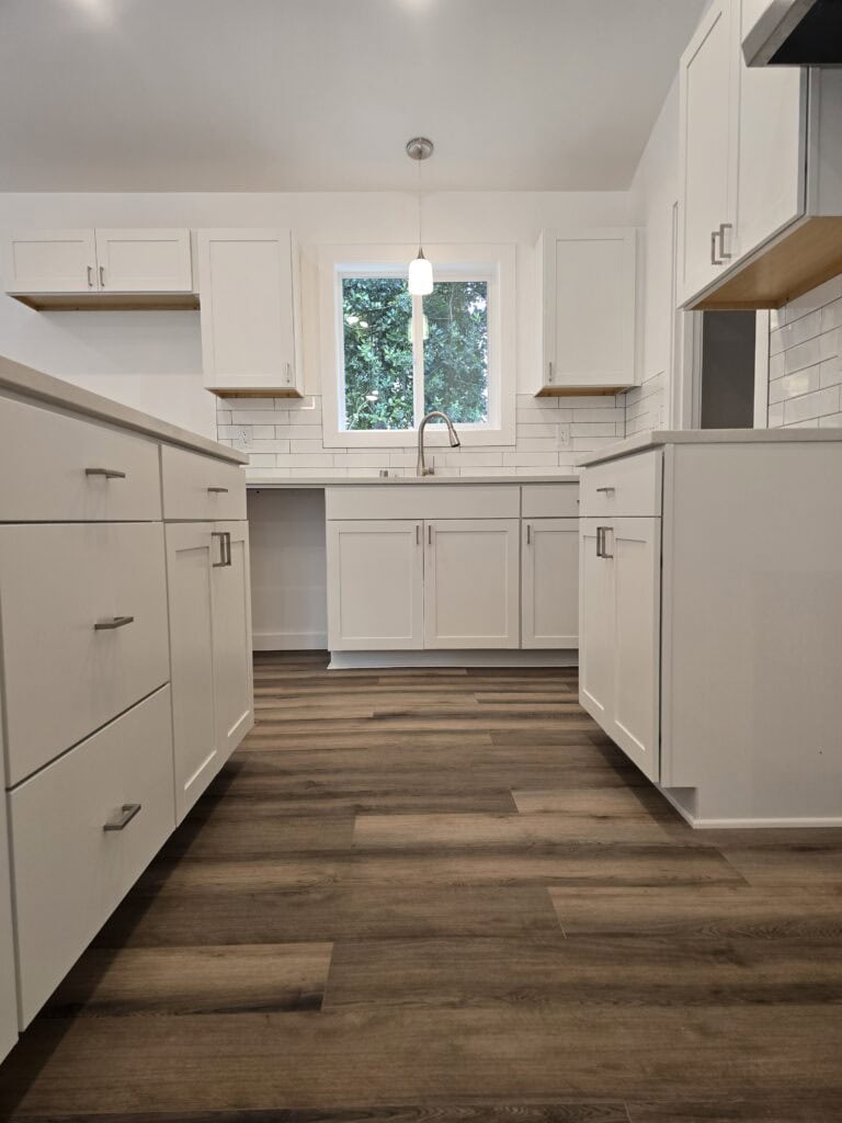 L-shaped island kitchen in a Wolf Model I modular home.