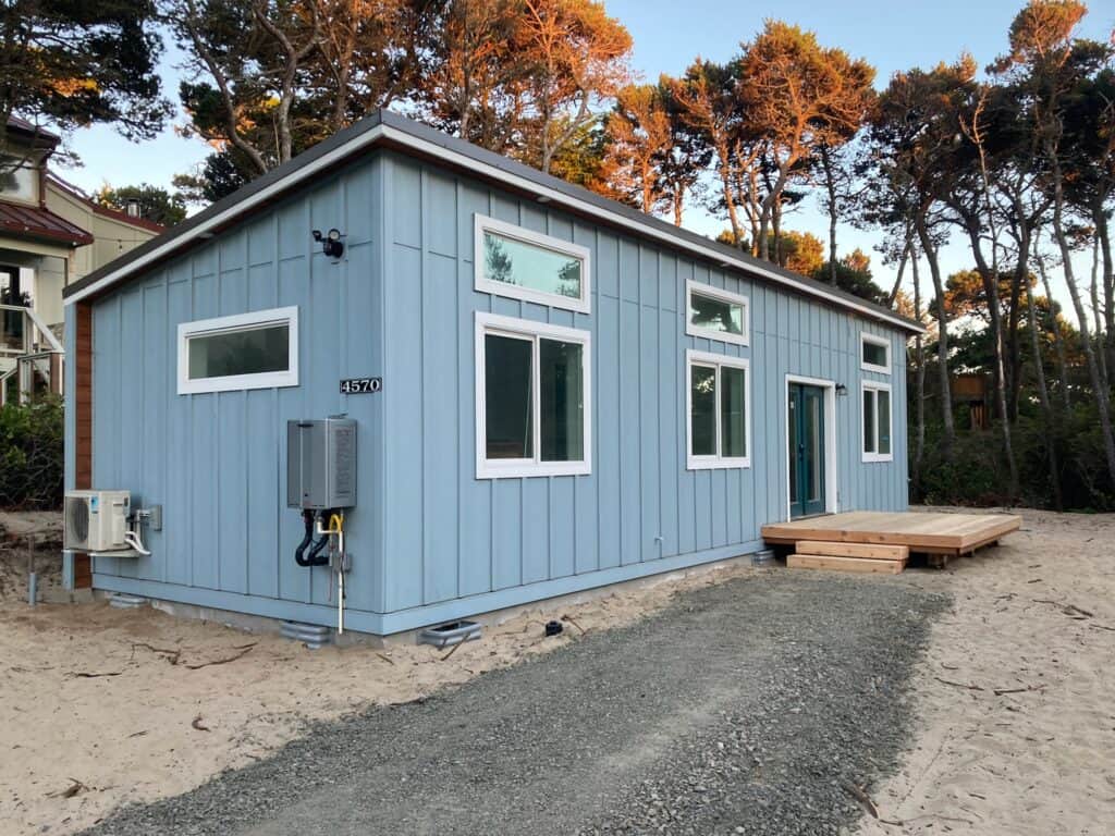 Light blue and white Wolf Model E beach house in Florence OR