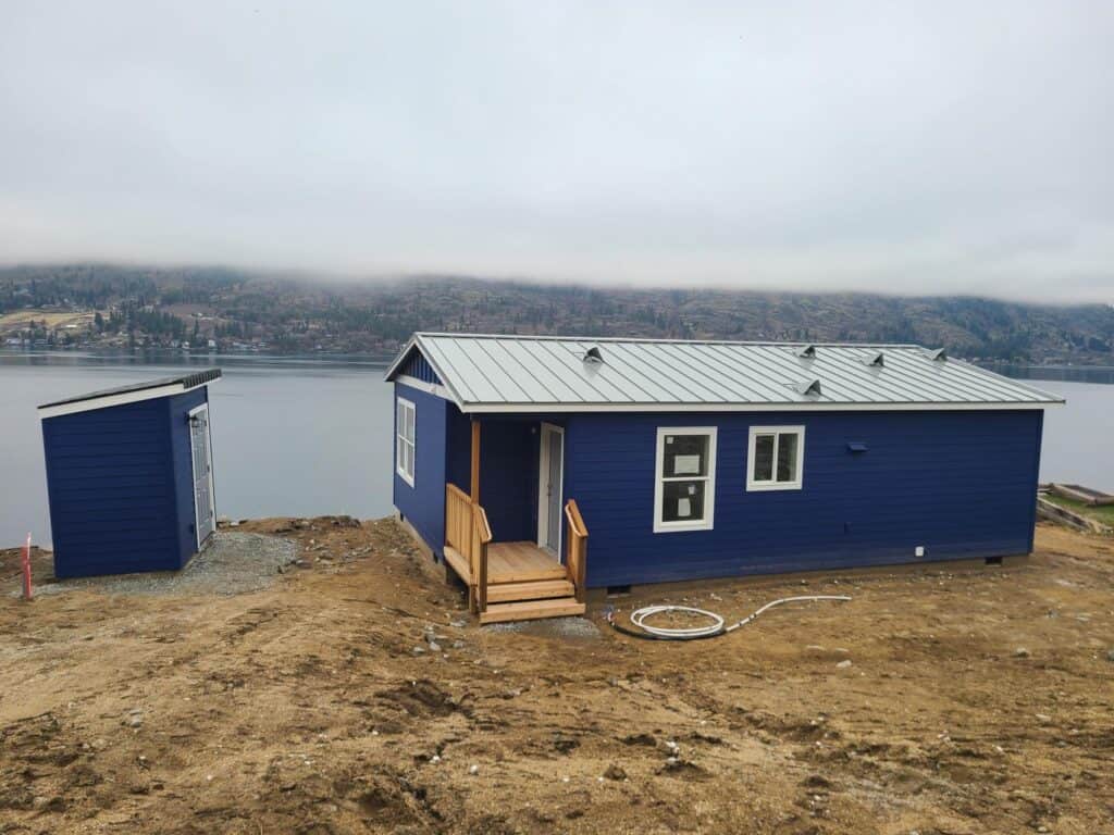 Blue and white Wolf Model J modular home on Lake Chelan in Manson WA