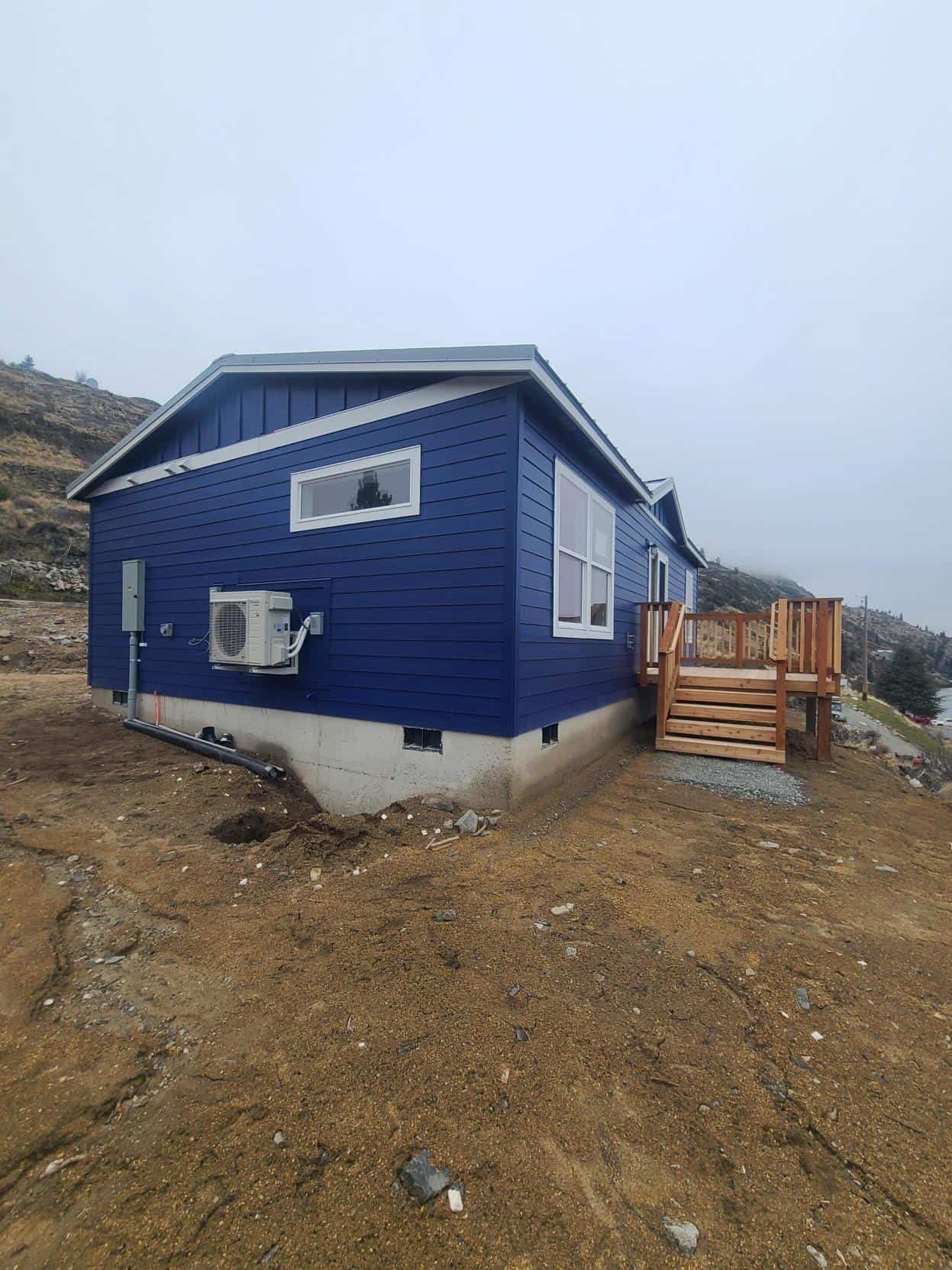 Blue and White Wolf Model J Modular Home on Lake Chelan