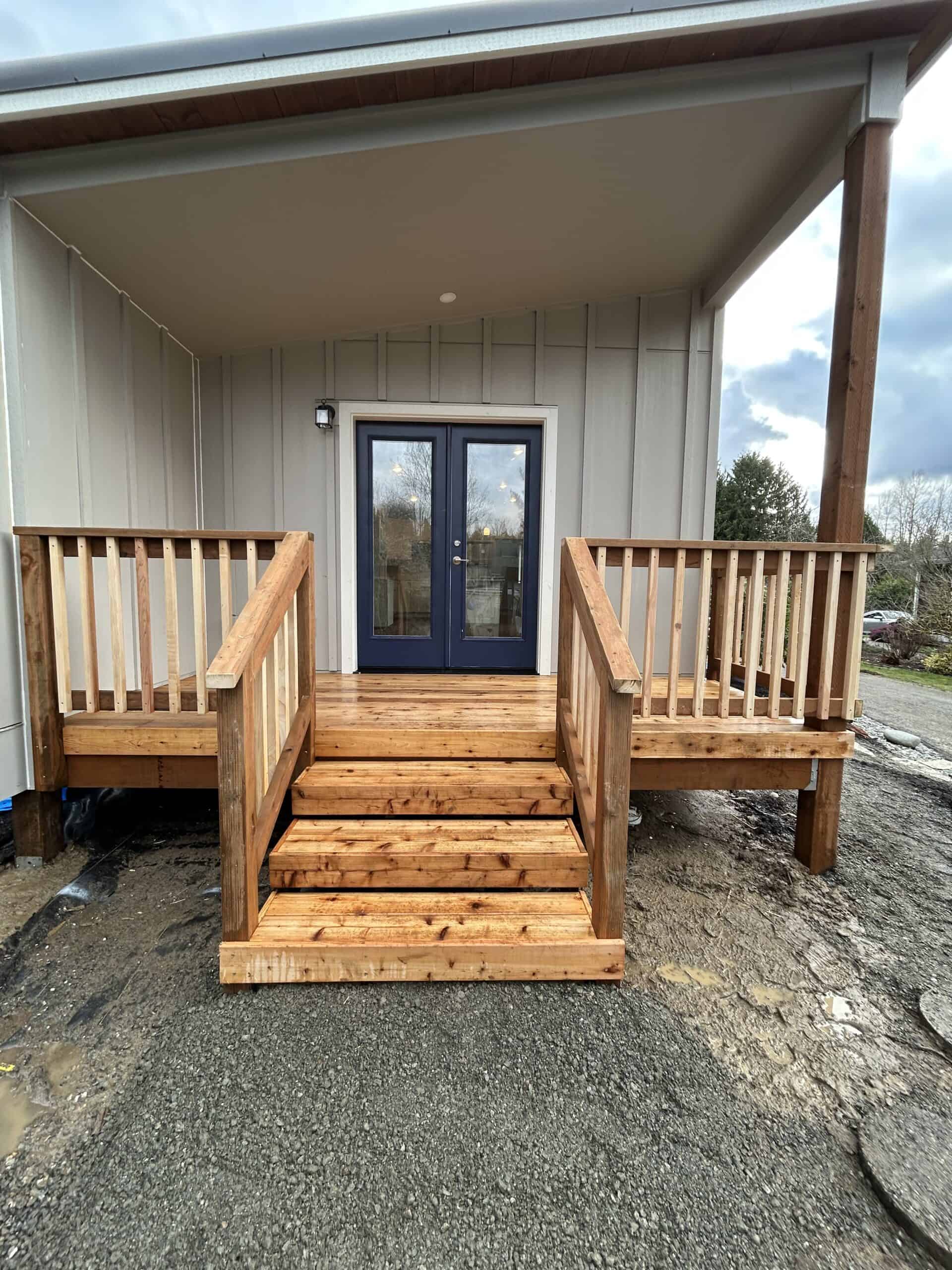 Covered porch with deck and French doors on a Wolf Model E ADU.