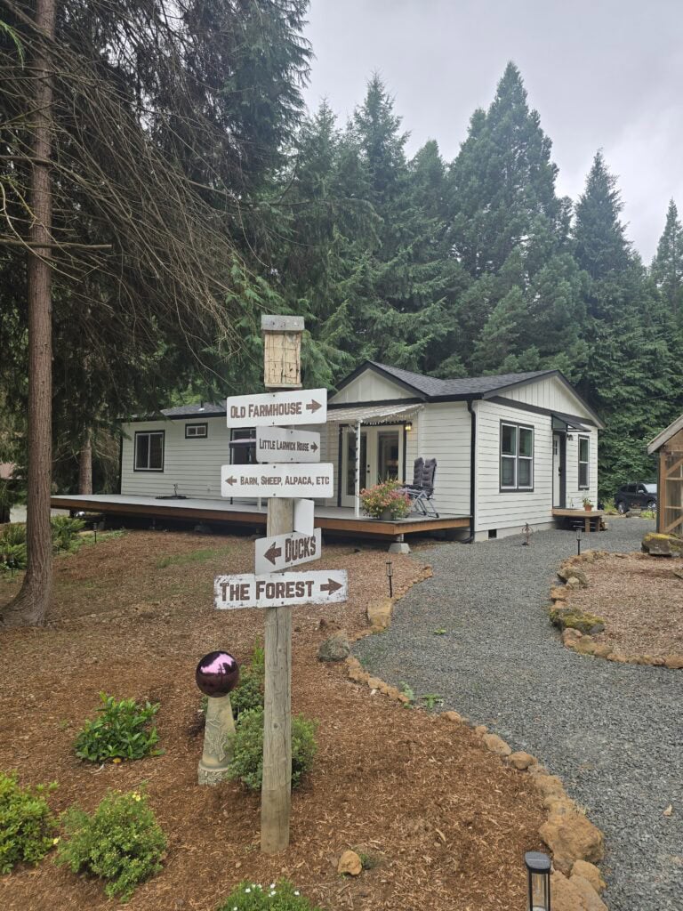 Fun sign at a White and black Wolf Model I modular home in Battle Ground WA