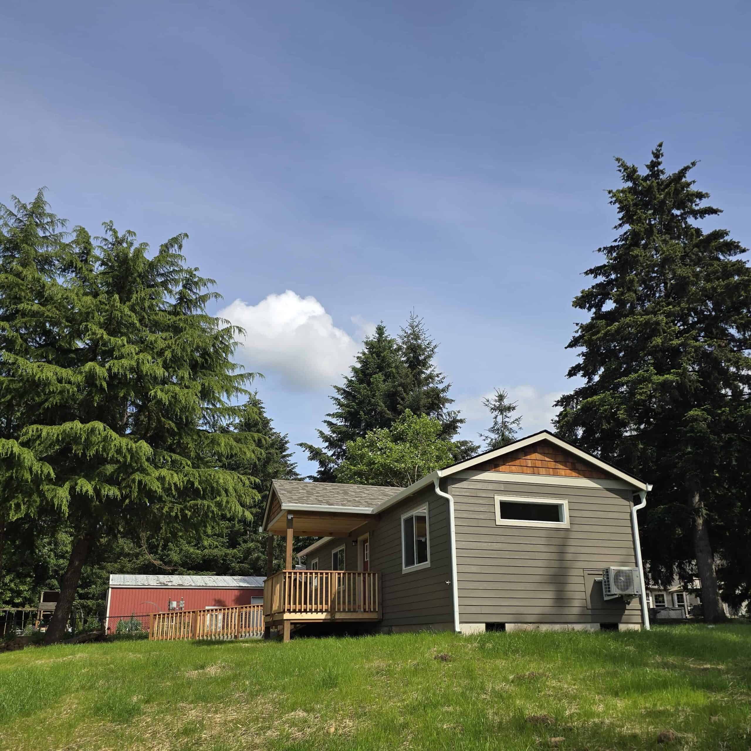 Wolf Model E home with ramped and covered entry with cedar shake gable.